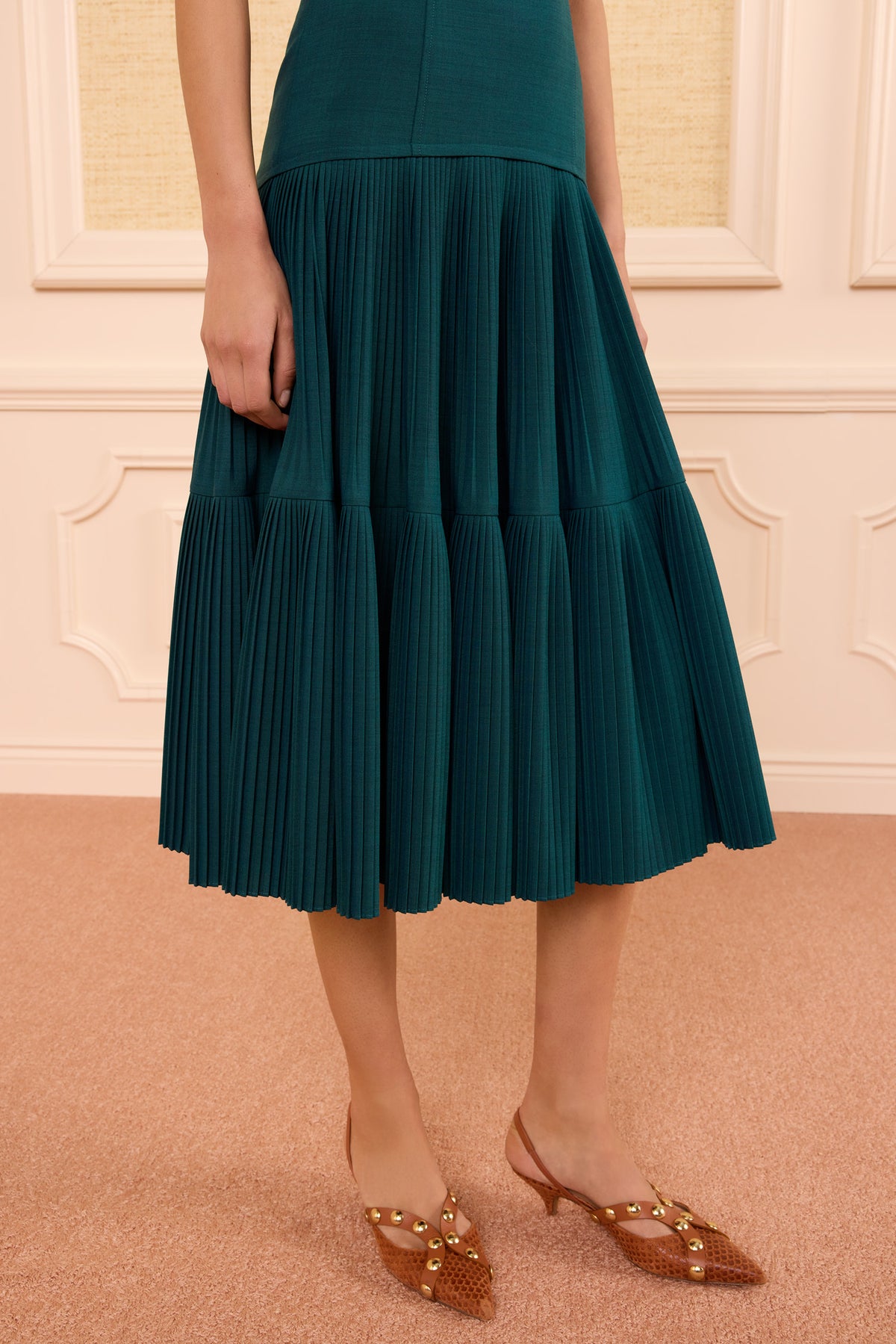 Jewel Green Pleated Wool Midi Skirt Detail - Close-Up On Model | Ulla Johnson