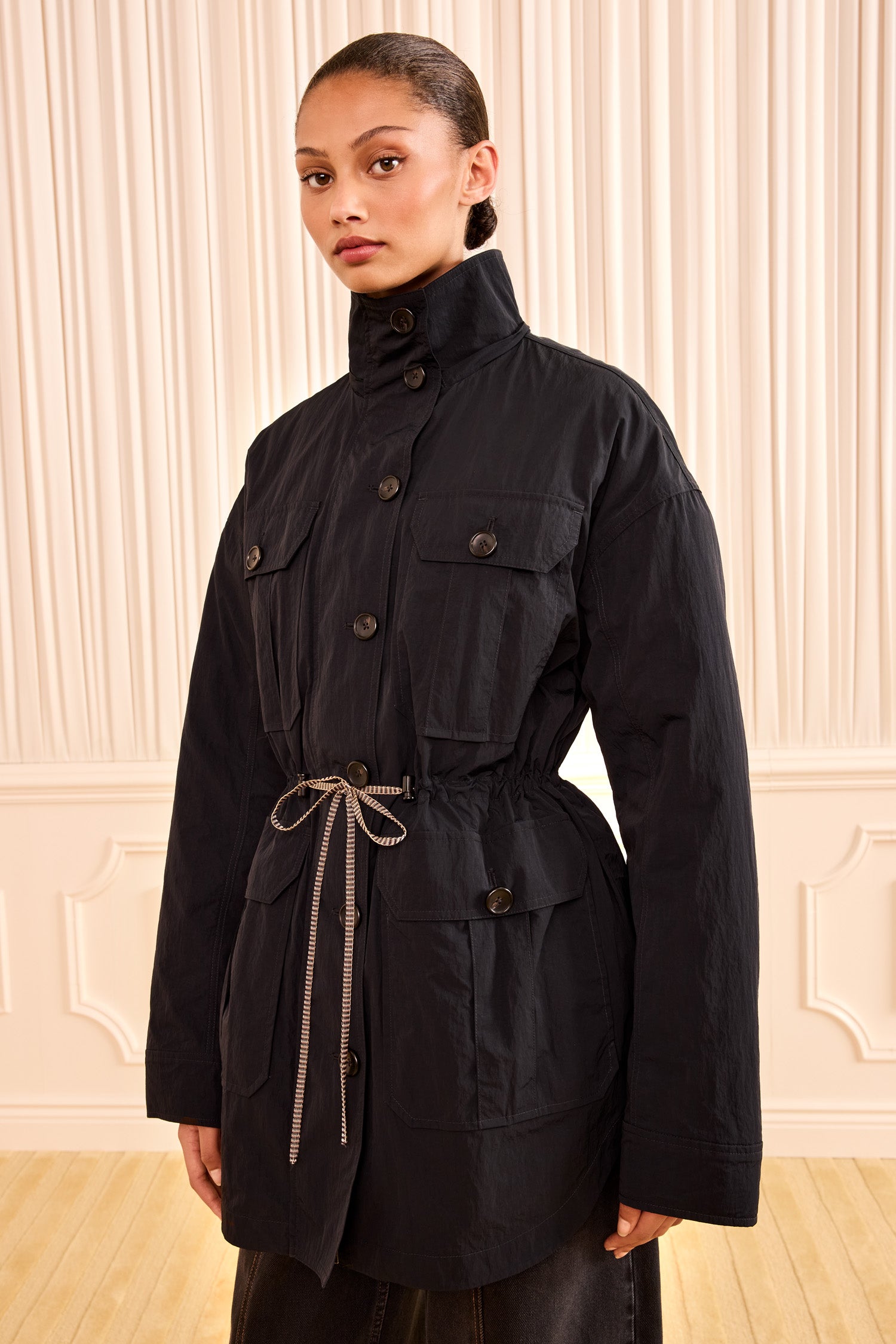 Ulla Johnson Noir Nylon Jacket with Hood Down, Self-Tie Waist - Three-Quarter View on Model | Ulla Johnson