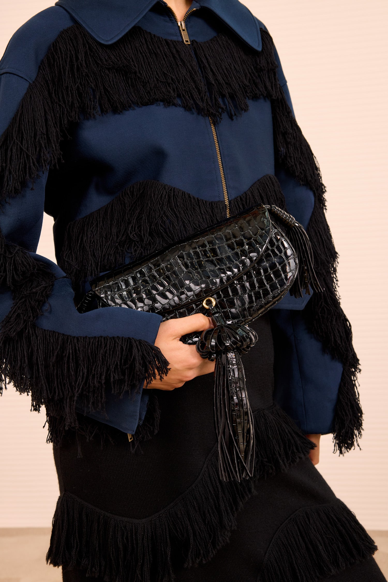Ulla Johnson Paloma Tassel Flap Bag Noir Held as Clutch - Styled Look with Fringed Jacket | Ulla Johnson