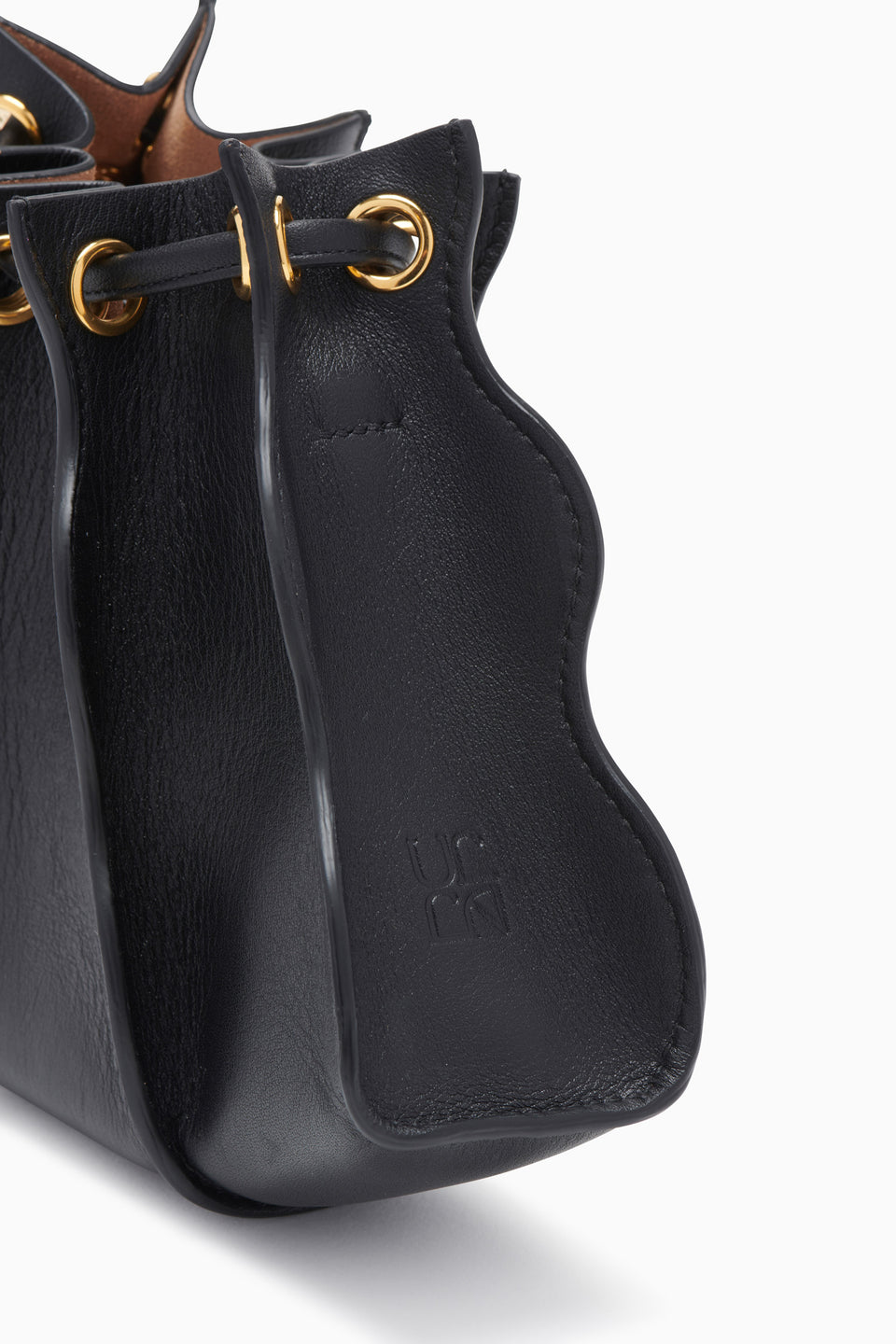 Black Leather Adria Wave Bag - Close-Up Hardware Detail Gold Grommets | Ulla Johnson