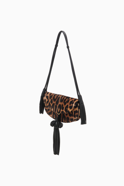 Leopard Calf Hair Designer Crossbody Bag with Black Leather Tassels - Side View | Ulla Johnson