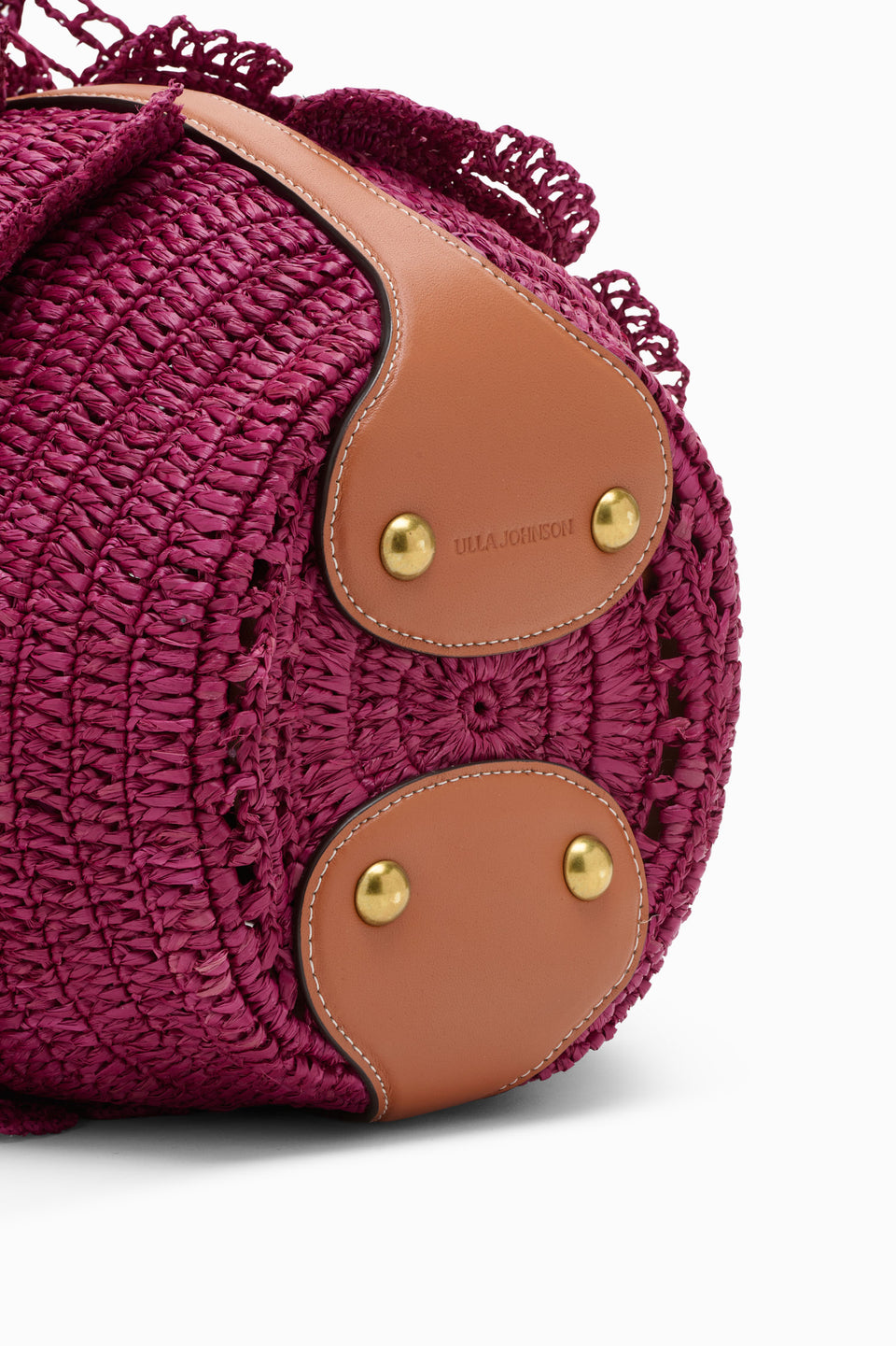 Orchid Raffia Bucket Bag Tan Leather Panel with Gold Studs & Brand Stamp - Close-Up | Ulla Johnson