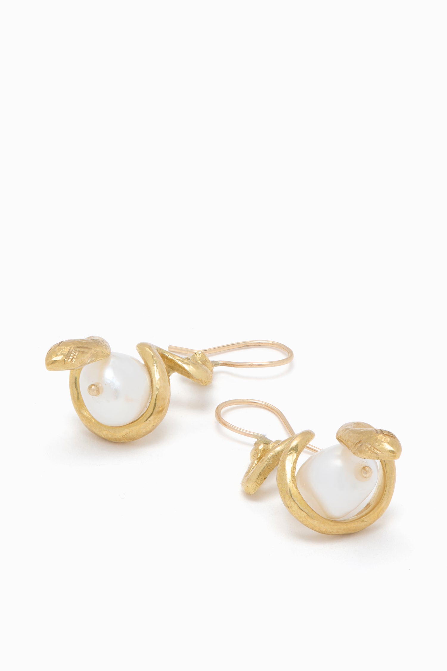 Ulla Johnson Gold Brass & Freshwater Pearl Snake Earrings - Coiled Detail Flat Lay | Ulla Johnson