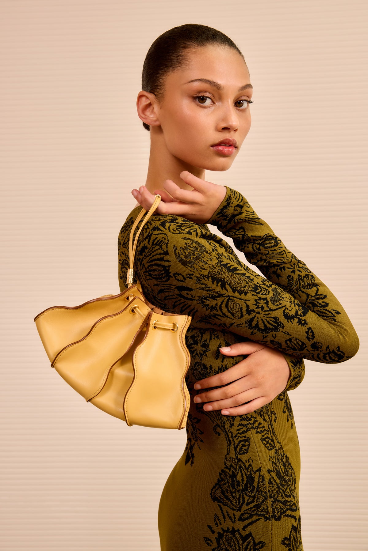 Model Wearing Lotus Yellow Adria Wave Crossbody as Wristlet - Styled Look | Ulla Johnson