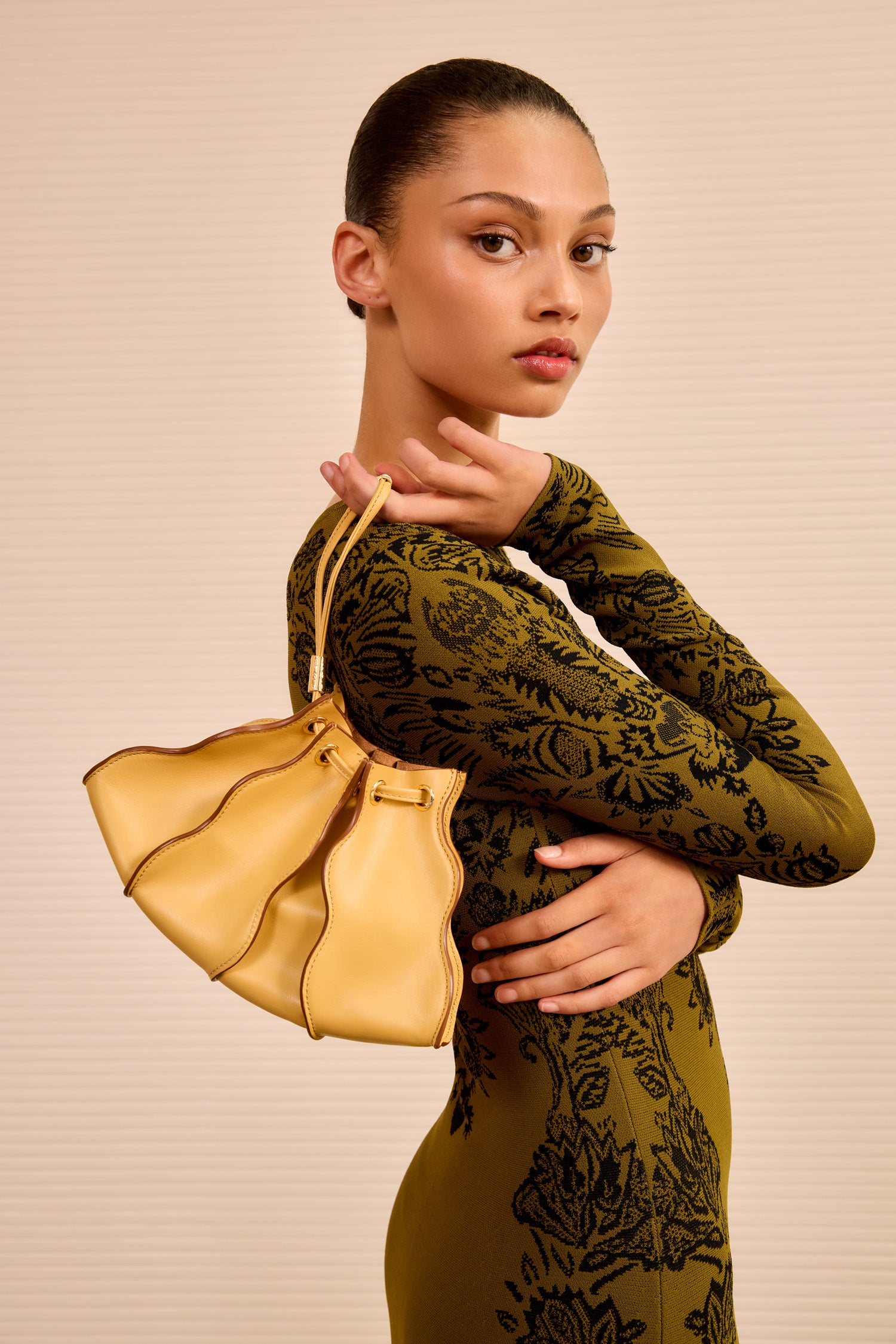 Ulla Johnson Model Wearing Lotus Yellow Adria Wave Crossbody as Wristlet - Styled Look | Ulla Johnson