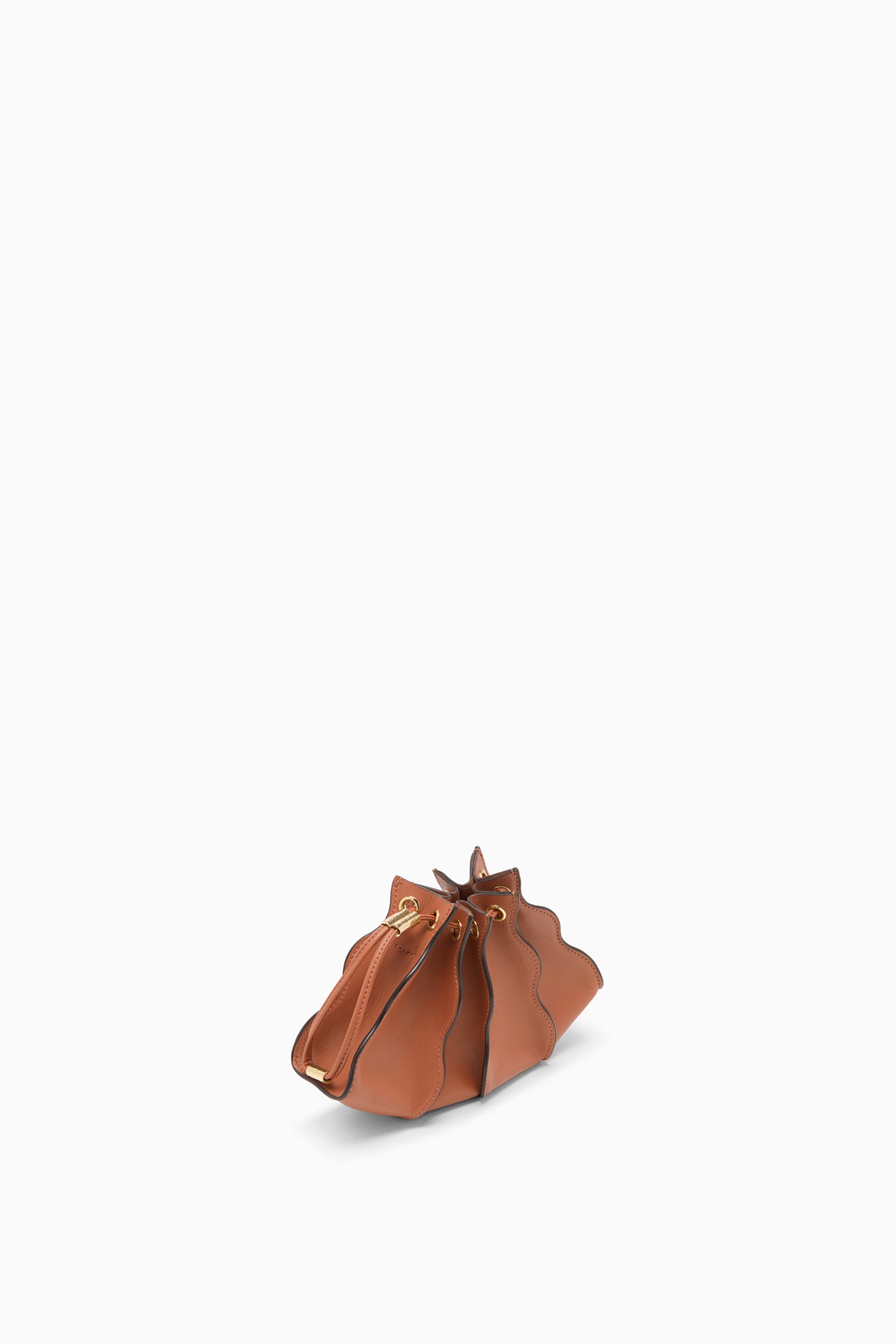 Ulla Johnson Sierra Tan Leather Adria Small Crossbody - Sculptural Wave Panel Angle View | Ulla Johnson