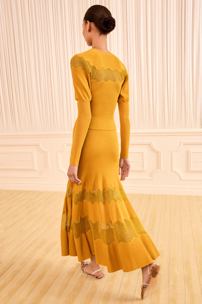 Topaz Gold Lurex Midi Knit Skirt - Back View Showing Fluted Hem On Model | Ulla Johnson