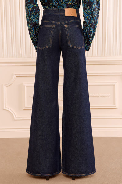 Tigris Dark Wash Flared Denim Jean - Full Back View On Model | Ulla Johnson